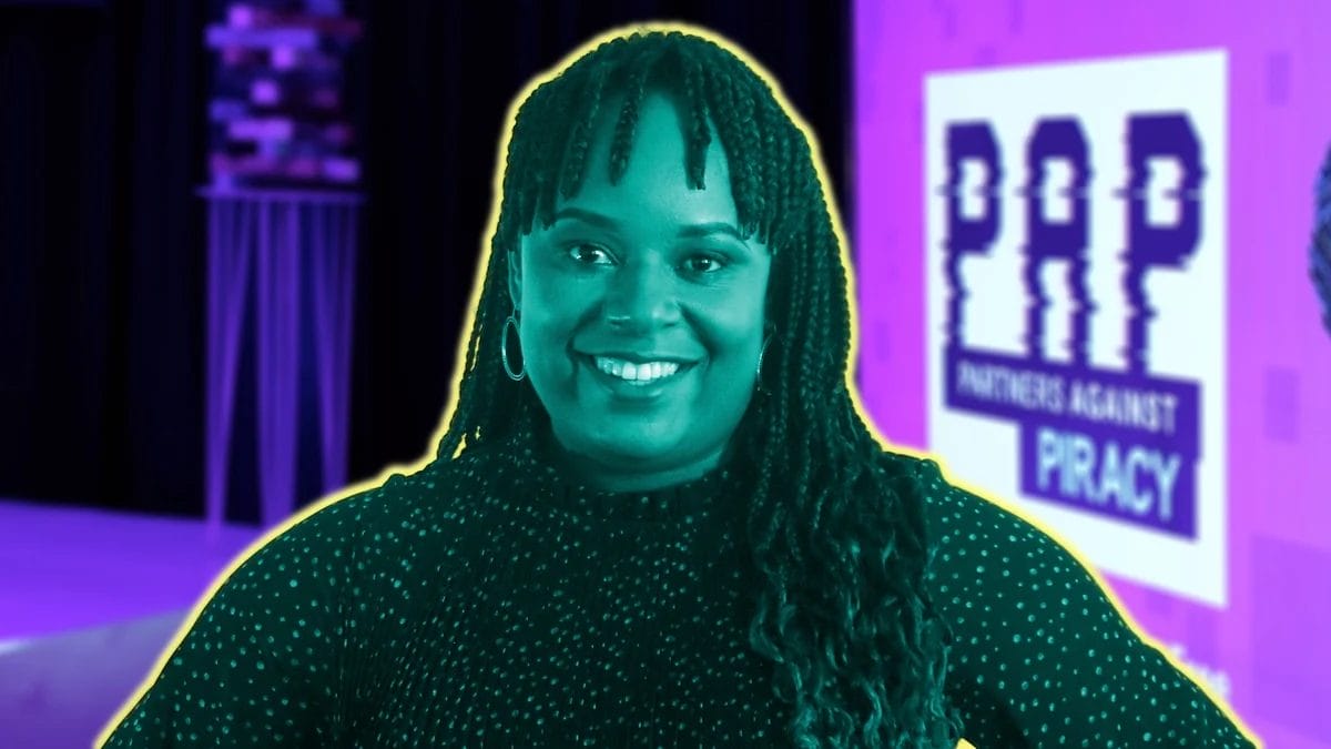A person with long plaits and hoop earrings smiles at the camera. The image has a teal and purple filter with a yellow outline. In the background, a blurred sign reads 