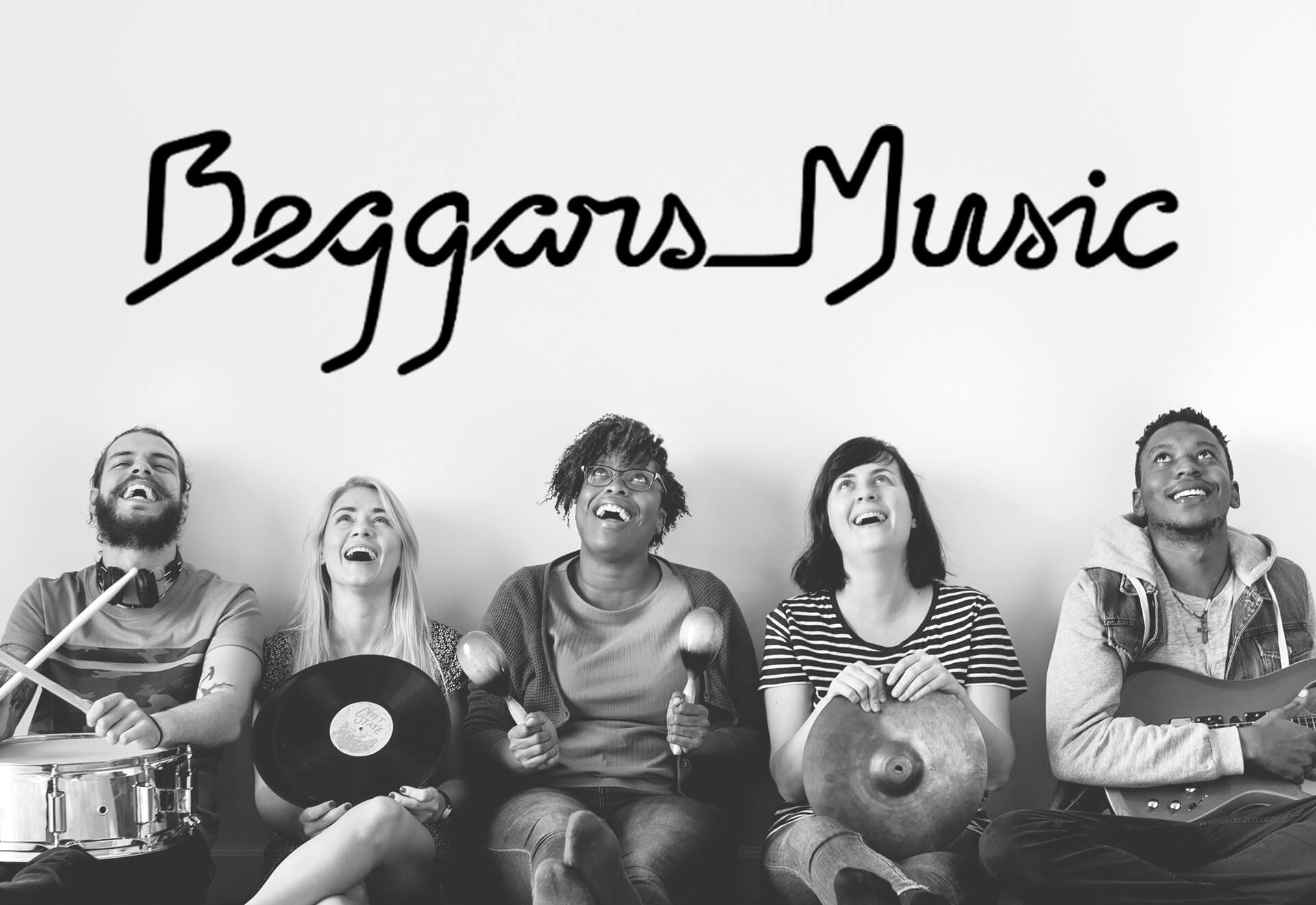 Five people sit in a row, smiling and laughing, each holding musical instruments. Above them, “Beggars Music” appears in stylised black handwriting—a joyful scene celebrating the partnership between talented artists.