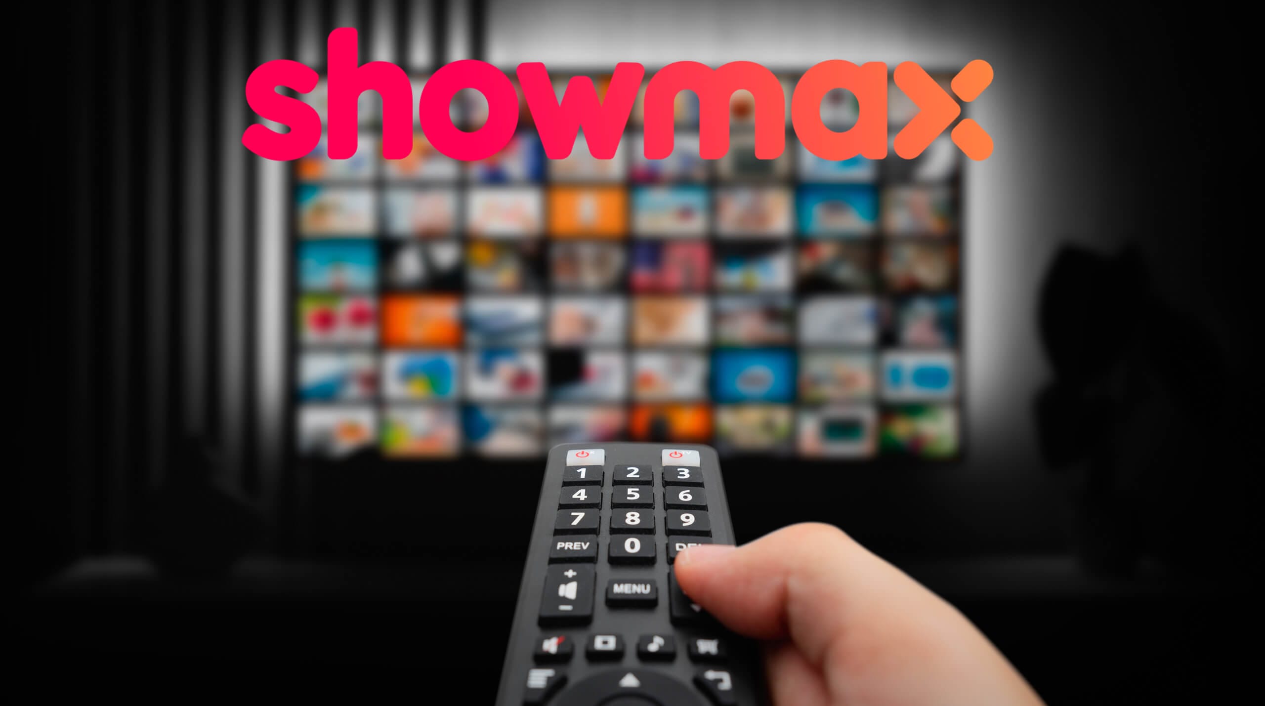 A hand points a TV remote at a blurred screen with colourful thumbnails, highlighting the "showmax" logo in bold pink and orange. The scene suggests streaming content selection by catalogue clients, spotlighting African creators.